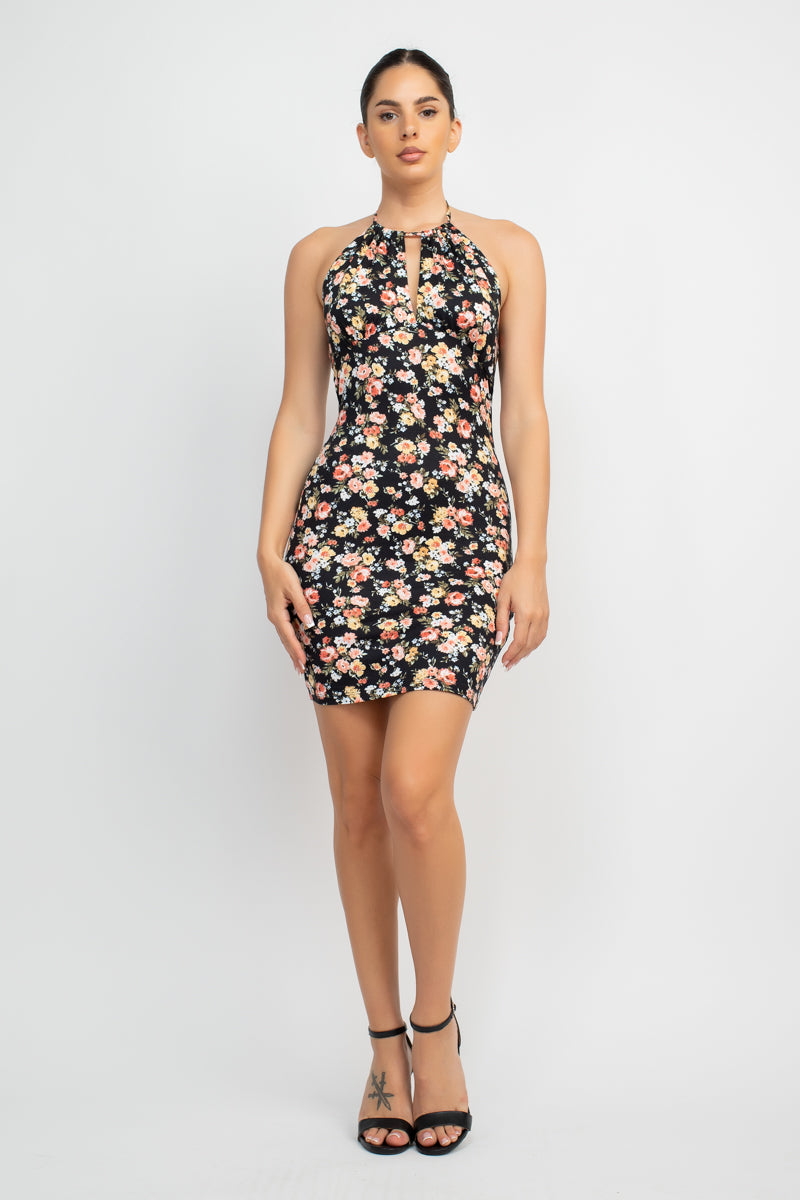 Halter Neck Cutout Ditsy Bodycon Dress A knit geek chic fashionable dress in an all-over ditsy floral print featuring a halter neckline, cutout detail, open back, bodycon silhouette, and a mini length,
