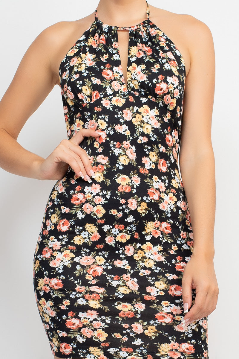 Halter Neck Cutout Ditsy Bodycon Dress A knit geek chic fashionable dress in an all-over ditsy floral print featuring a halter neckline, cutout detail, open back, bodycon silhouette, and a mini length,