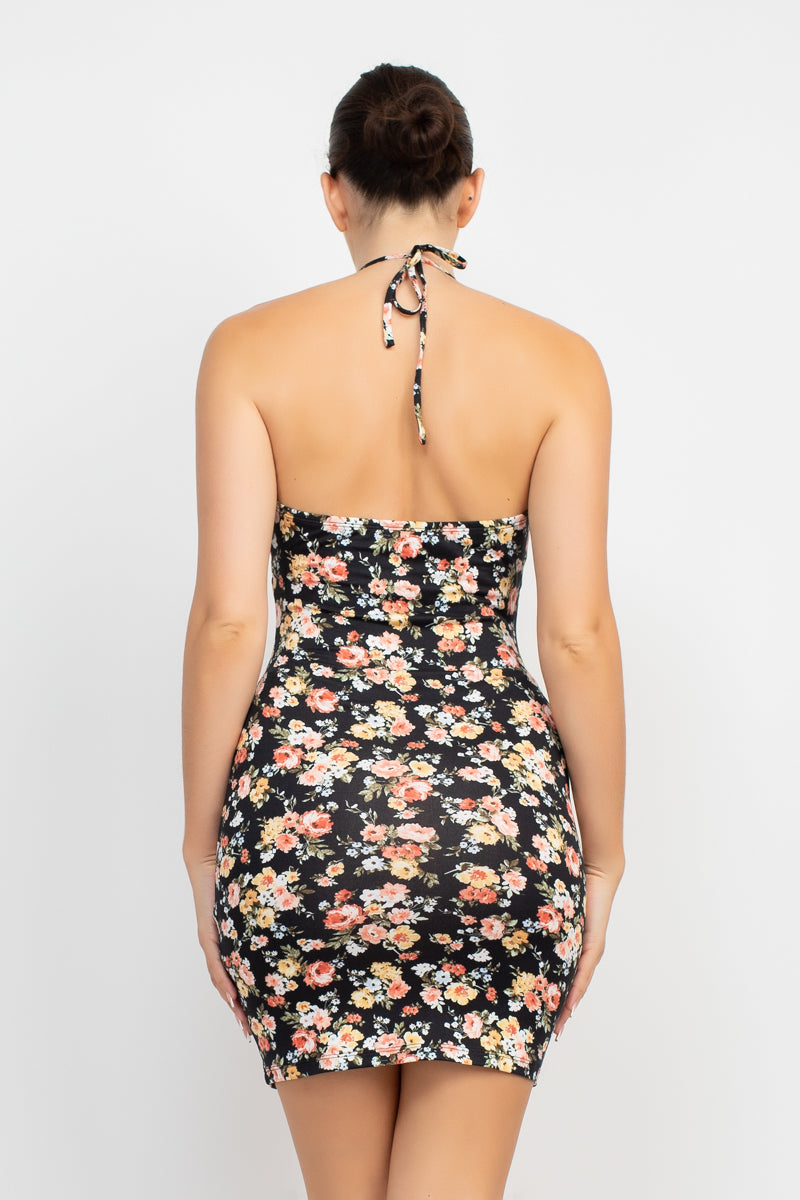 Halter Neck Cutout Ditsy Bodycon Dress A knit geek chic fashionable dress in an all-over ditsy floral print featuring a halter neckline, cutout detail, open back, bodycon silhouette, and a mini length,